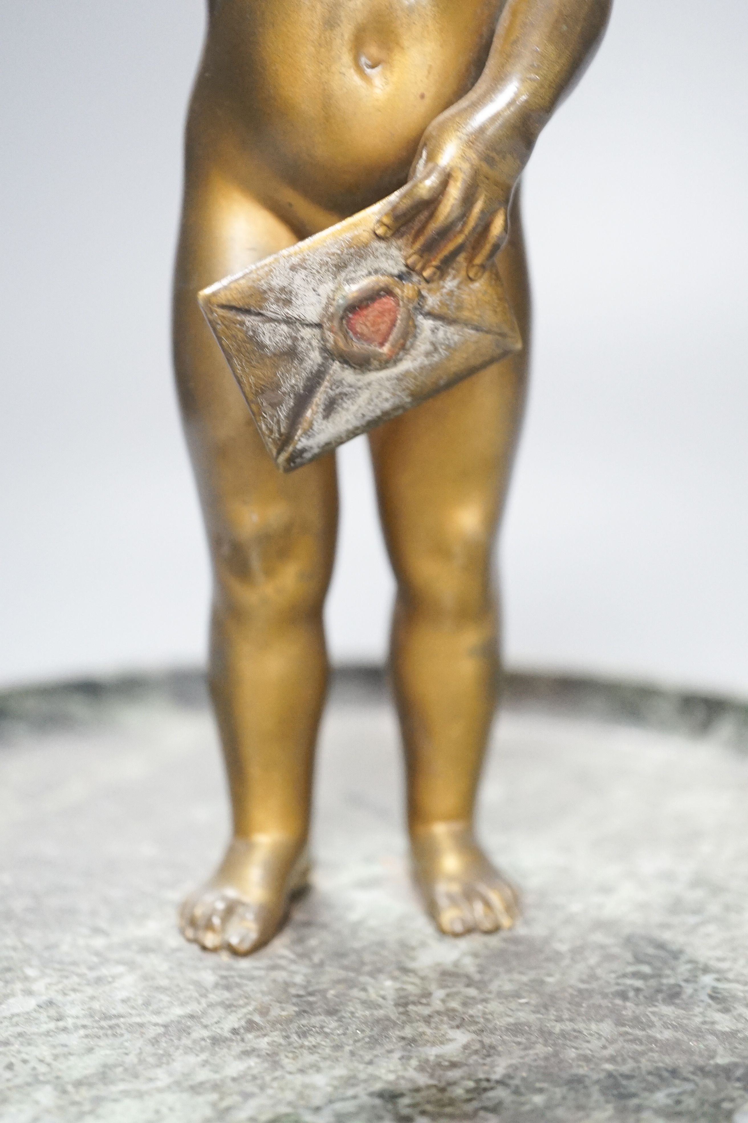 Early 20th century bronze of a child on a marble dish base 24cm